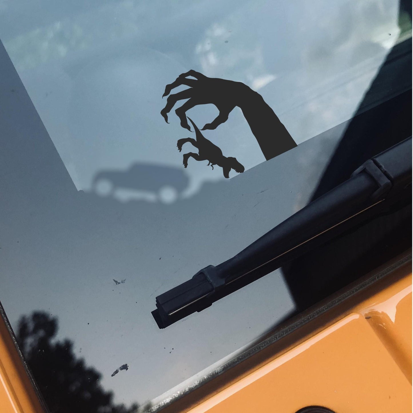 monster holding t-rex easter egg decal, small sticker for car windshield or mirror, removable sticker, windscreen decal, tiny hidden decals